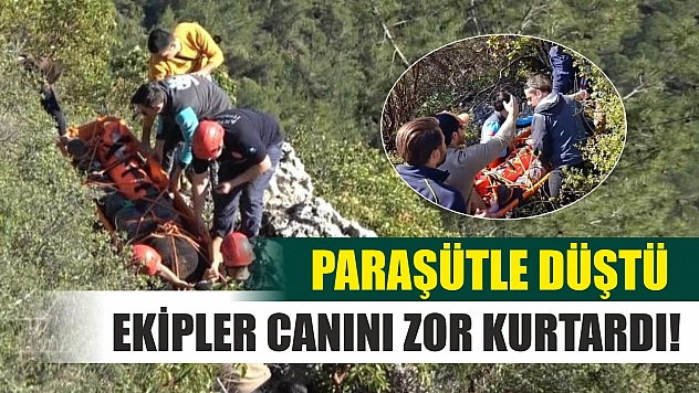 Alçak uçuş yaparken paraşütü makilere takıldı, düştüğü yerde mahsur kaldı
