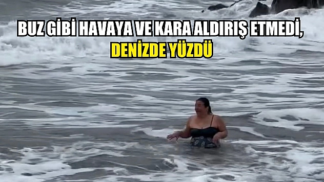 Buz gibi havaya ve kara aldırış etmedi, denizde yüzdü