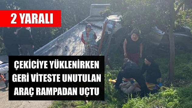 Çekiciye yüklenirken geri viteste unutulan araç rampadan uçtu: 2 yaralı