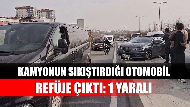 Kamyonun sıkıştırdığı otomobil refüje çıktı: 1 Yaralı