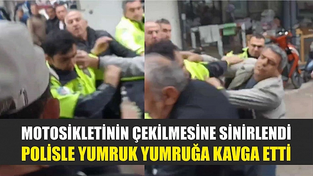 Motosikletinin çekilmesine sinirlendi, polisle yumruk yumruğa kavga etti