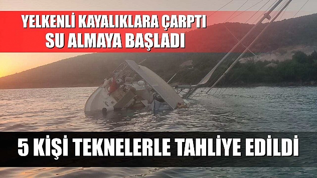Yelkenli kayalıklara çarptı, su almaya başladı: 5 kişi teknelerle tahliye edildi