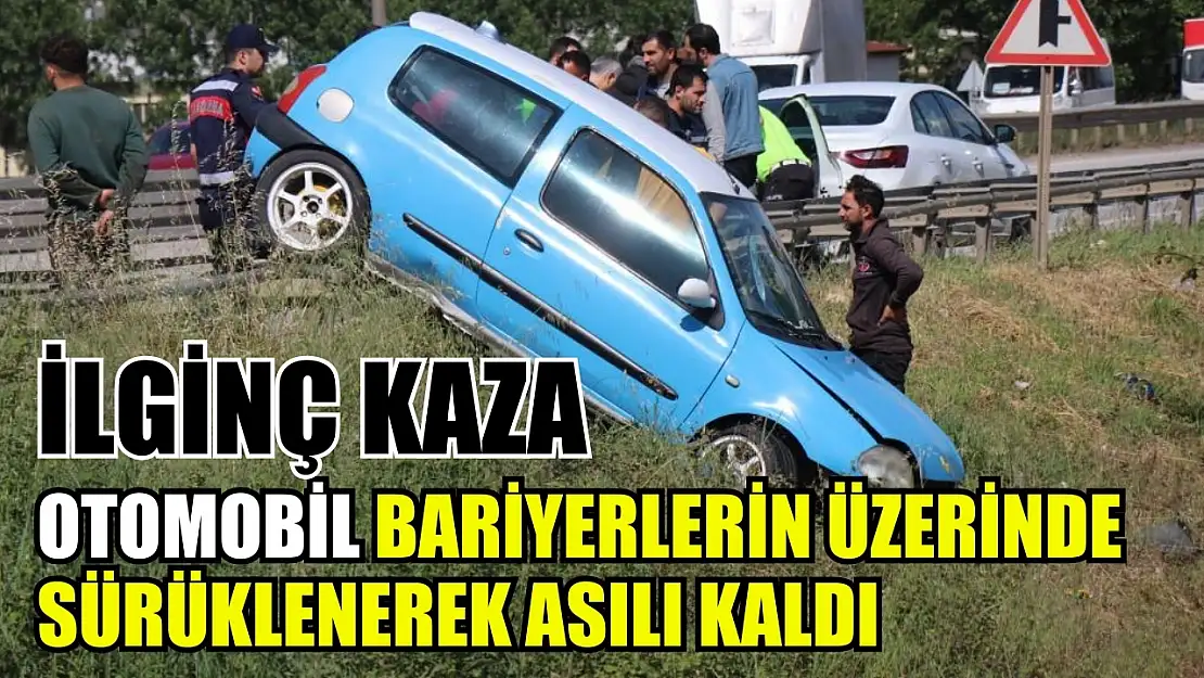 İlginç kaza: Otomobil bariyerlerin üzerinde sürüklenerek asılı kaldı