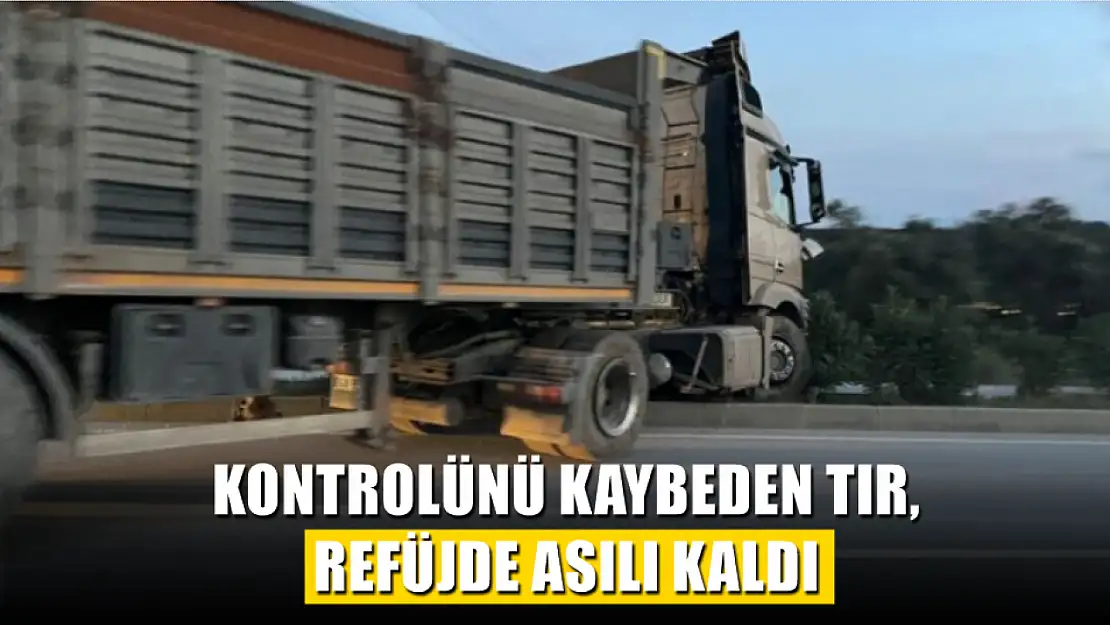 Kontrolünü kaybeden tır, refüjde asılı kaldı