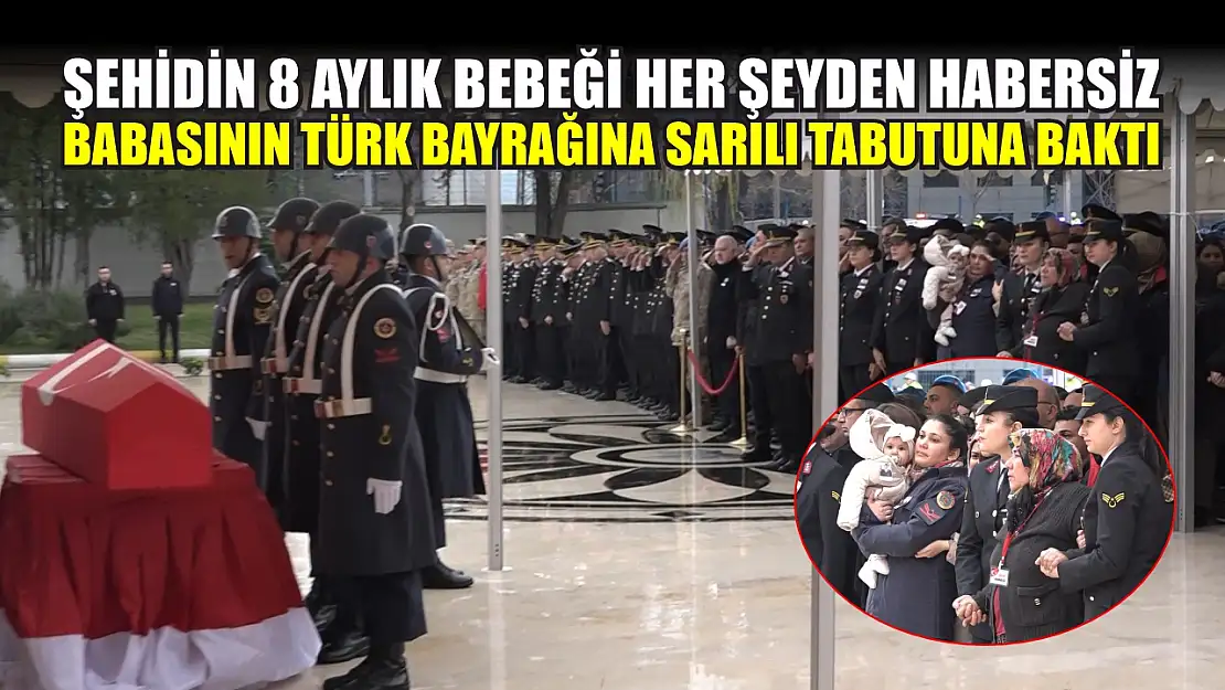 Şehidin 8 aylık bebeği her şeyden habersiz babasının Türk bayrağına sarılı tabutuna baktı