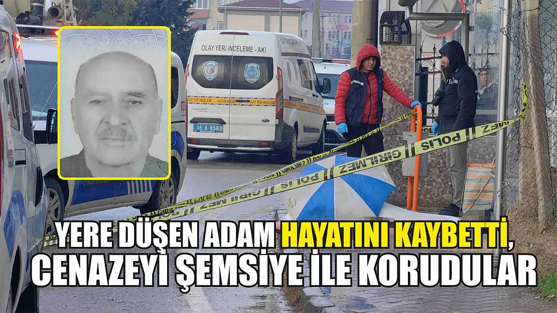 Yere düşen adam hayatını kaybetti, cenazeyi şemsiye ile korudular