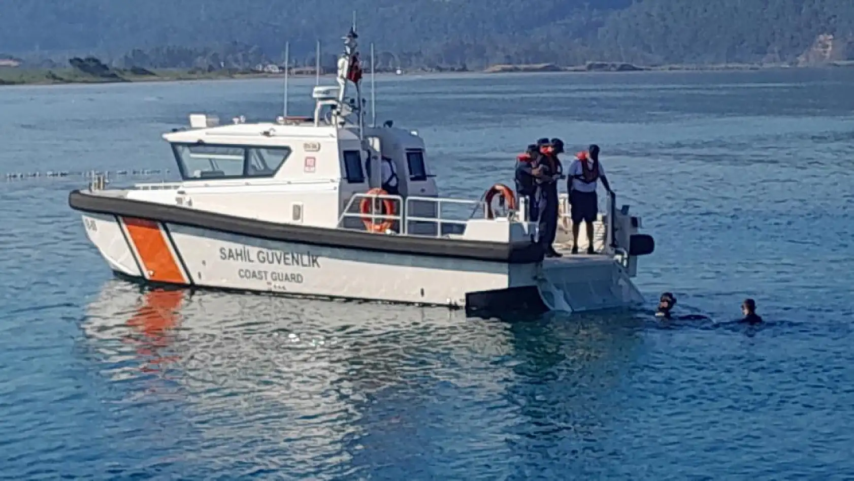 Ula'da akülü sandalye ile geldiği iskeleden kendini denize bıraktı