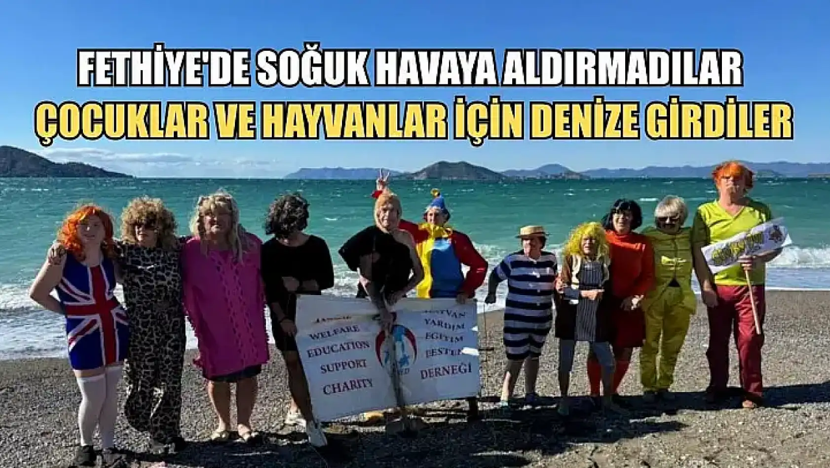 Fethiye'de soğuk havaya aldırmadılar, çocuklar ve hayvanlar için denize girdiler