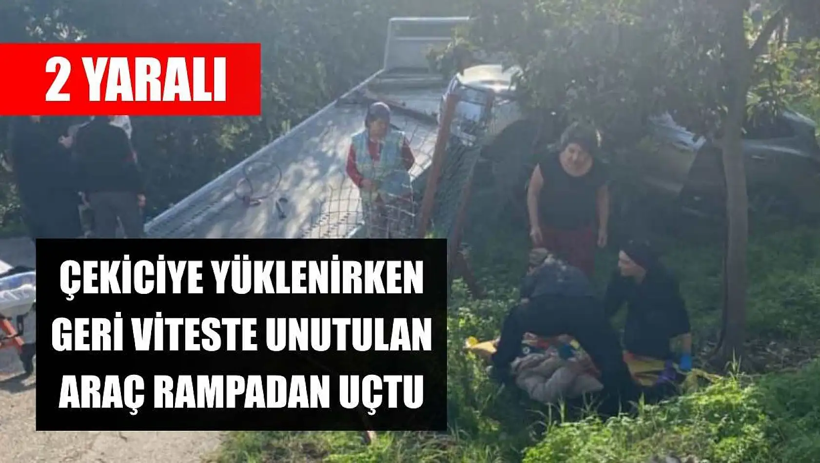 Çekiciye yüklenirken geri viteste unutulan araç rampadan uçtu: 2 yaralı