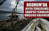 Bodrum'da kıyıya terkedilmiş sahipsiz tekneler vinçlerle kaldırıldı