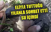 Eliyle tuttuğu yılanla sohbet etti, su içirdi