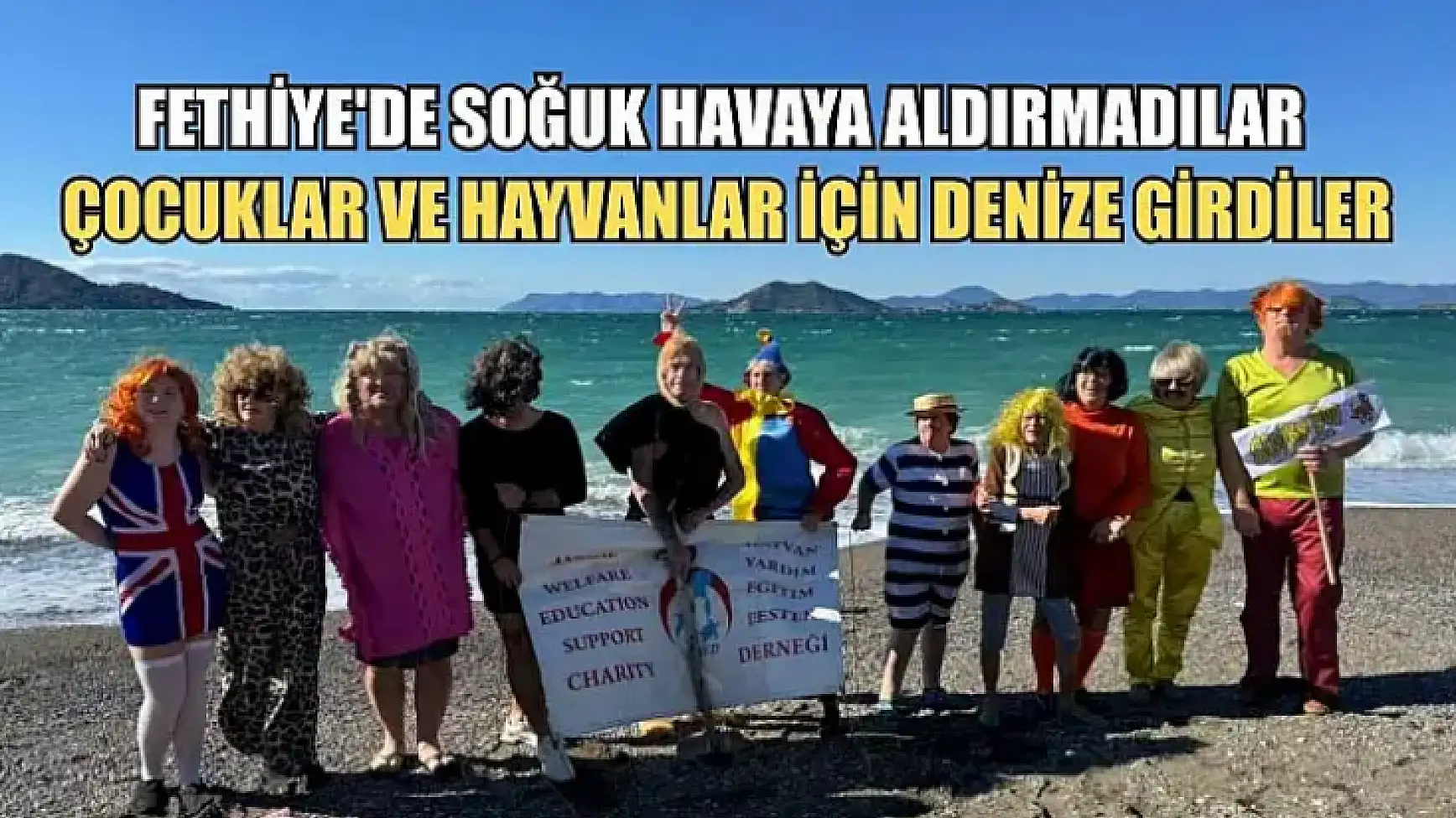 Fethiye'de soğuk havaya aldırmadılar, çocuklar ve hayvanlar için denize girdiler
