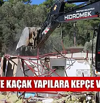 Akbük'te kaçak yapılara kepçe vuruldu
