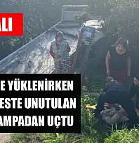 Çekiciye yüklenirken geri viteste unutulan araç rampadan uçtu: 2 yaralı