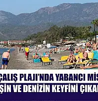 Fethiye Çalış Plajı'nda yabancı misafirler güneşin ve denizin keyfini çıkarıyor