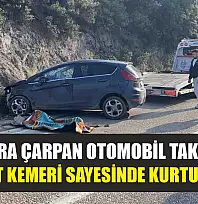 Kayalara çarpan otomobil takla attı, emniyet kemeri sayesinde kurtuldular
