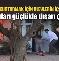 Kedisini kurtarmak için alevlerin içine daldı komşuları güçlükle dışarı çıkardı