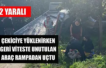 Çekiciye yüklenirken geri viteste unutulan araç rampadan uçtu: 2 yaralı