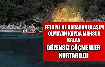 Fethiye'de karadan ulaşım olmayan koyda mahsur kalan düzensiz göçmenler kurtarıldı