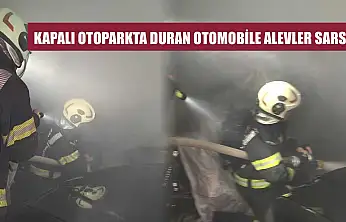 Kapalı otoparkta duran otomobile alevler sarsı