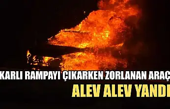 Karlı rampayı çıkarken zorlanan araç alev alev yandı