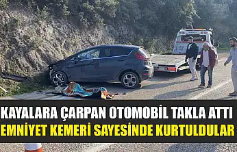Kayalara çarpan otomobil takla attı, emniyet kemeri sayesinde kurtuldular
