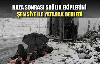 Kaza sonrası sağlık ekiplerini şemsiye ile yatarak bekledi