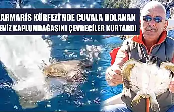Marmaris Körfezi'nde çuvala dolanan deniz kaplumbağasını çevreciler kurtardı