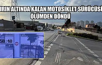 Tırın altında kalan motosiklet sürücüsü ölümden döndü