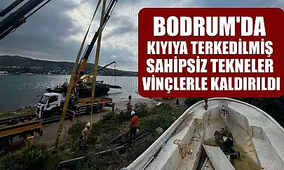 Bodrum'da kıyıya terkedilmiş sahipsiz tekneler vinçlerle kaldırıldı
