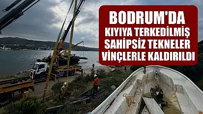 Bodrum'da kıyıya terkedilmiş sahipsiz tekneler vinçlerle kaldırıldı