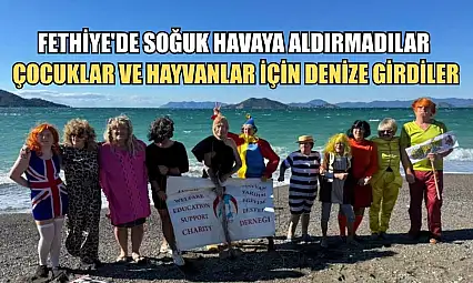 Fethiye'de soğuk havaya aldırmadılar, çocuklar ve hayvanlar için denize girdiler
