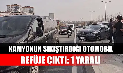 Kamyonun sıkıştırdığı otomobil refüje çıktı: 1 Yaralı