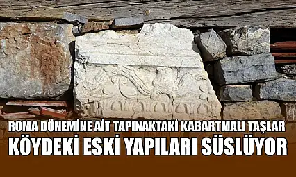 Roma dönemine ait tapınaktaki kabartmalı taşlar köydeki eski yapıları süslüyor