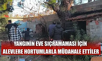 Yangının eve sıçramaması için alevlere hortumlarla müdahale ettiler
