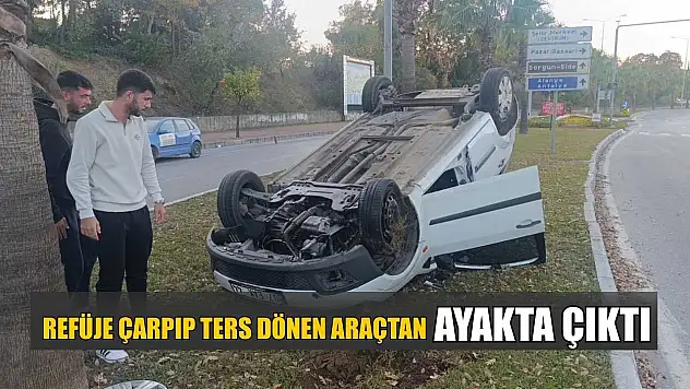 Refüje çarpıp ters dönen araçtan ayakta çıktı