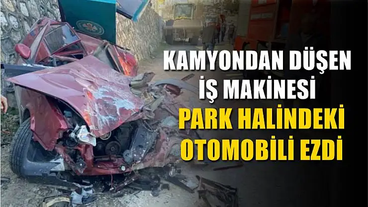 Kamyondan düşen iş makinesi park halindeki otomobili ezdi