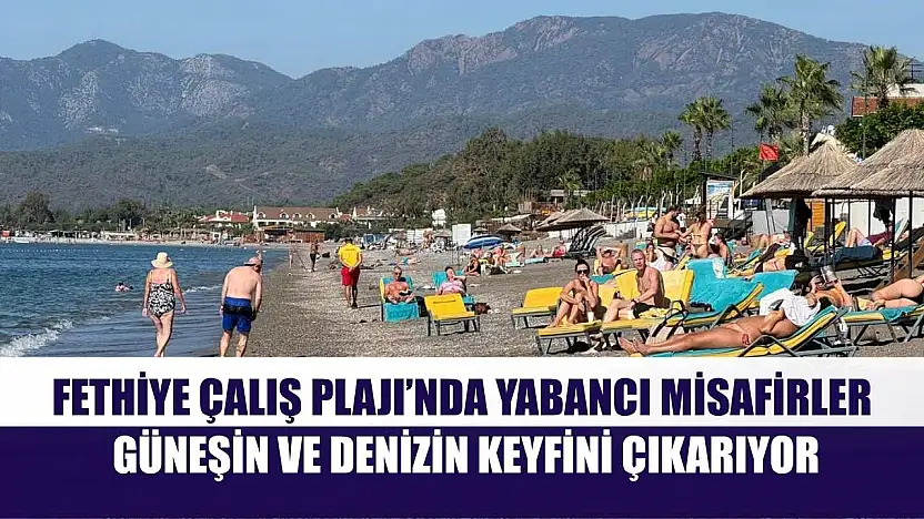 Fethiye Çalış Plajı'nda yabancı misafirler güneşin ve denizin keyfini çıkarıyor