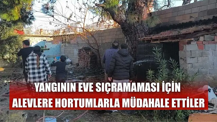 Yangının eve sıçramaması için alevlere hortumlarla müdahale ettiler