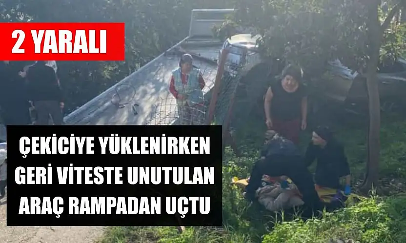 Çekiciye yüklenirken geri viteste unutulan araç rampadan uçtu: 2 yaralı