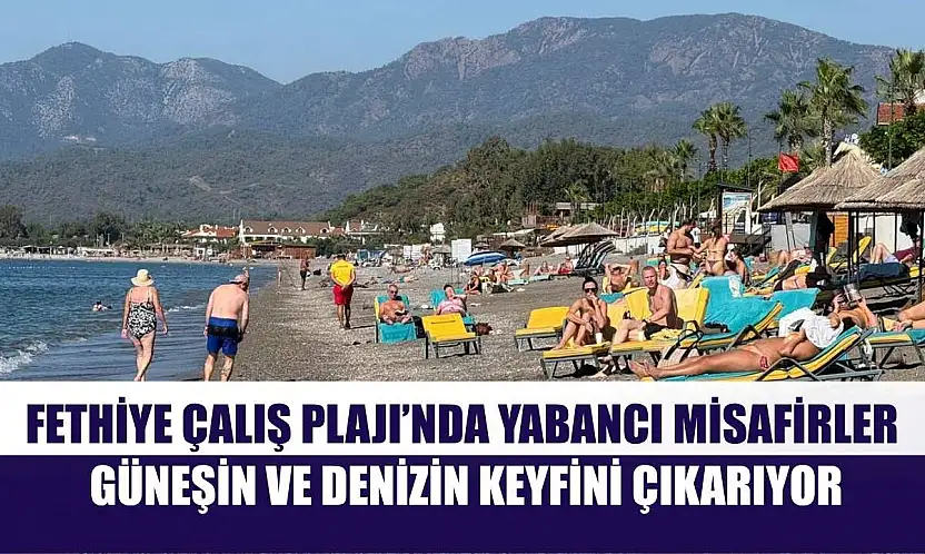 Fethiye Çalış Plajı'nda yabancı misafirler güneşin ve denizin keyfini çıkarıyor