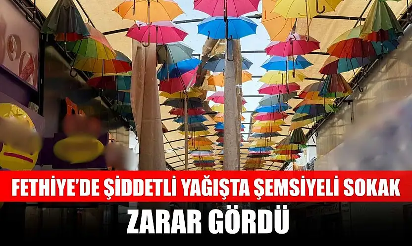 Fethiye'de şiddetli yağışta şemsiyeli sokak zarar gördü