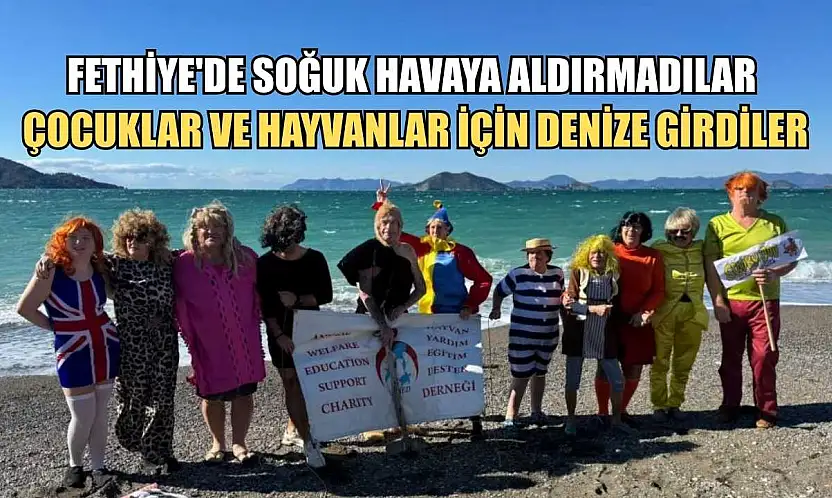 Fethiye'de soğuk havaya aldırmadılar, çocuklar ve hayvanlar için denize girdiler