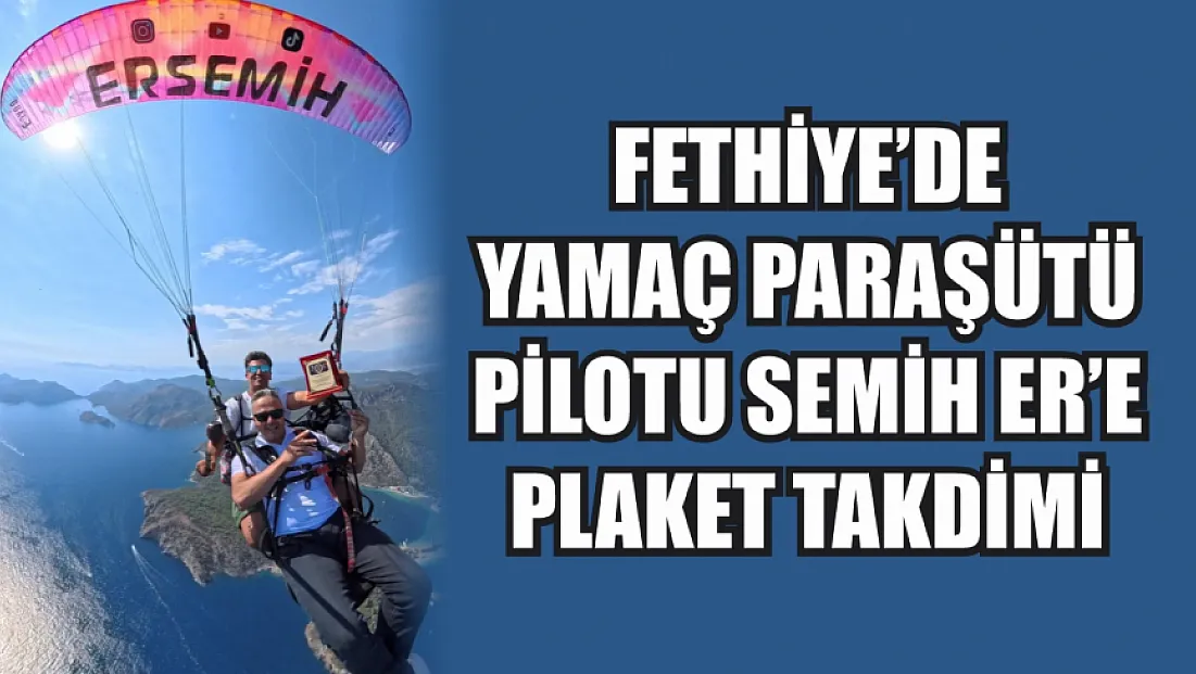 Fethiye’de Yamaç Paraşütü Pilotu Semih Er’e Plaket Takdimi