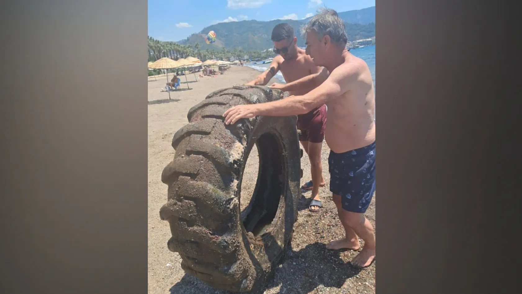 Marmaris Halk Plajı'nda denizden çıkan dev lastik şaşırttı