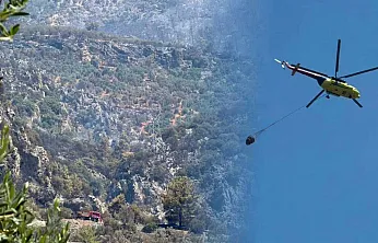 Fethiye'deki orman yangını sonrası soğutma çalışmaları havadan ve karadan sürüyor