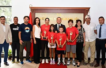 Milli takım gururu yaşatan Fethiyeli sporcular Kaymakam Akkaya'yı ziyaret etti