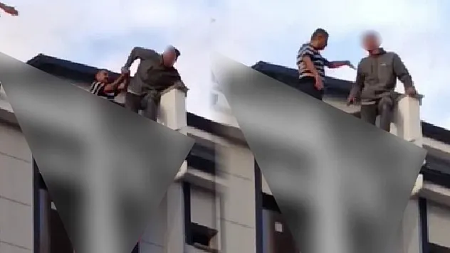 Eşiyle tartışıp çatıya çıkan genci Başkan son anda çekip aldı