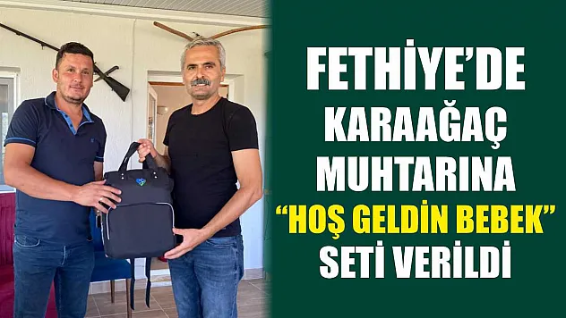 Fethiye'de Karaağaç Muhtarına 'Hoş Geldin Bebek' Seti Verildi