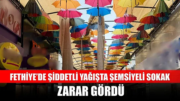 Fethiye'de şiddetli yağışta şemsiyeli sokak zarar gördü